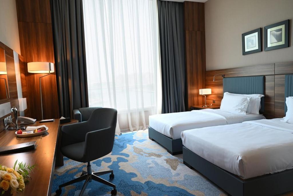 เบย์ ลา ซัน โฮเต็ล แอนด์ มารีนา Hotel King Abdullah Economic City ภายนอก รูปภาพ A room at the hotel